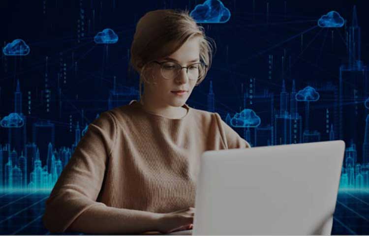 A girl working on a laptop with cloud services in the background