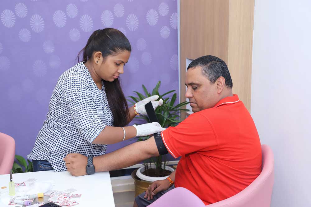 Picture taken while checking blood pressure in a health checkup camp organized by Aakash Healthcare Hospital in the office.