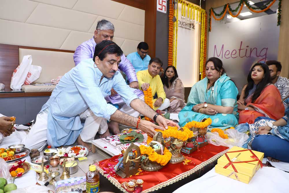 Photo of all the people sitting together in puja