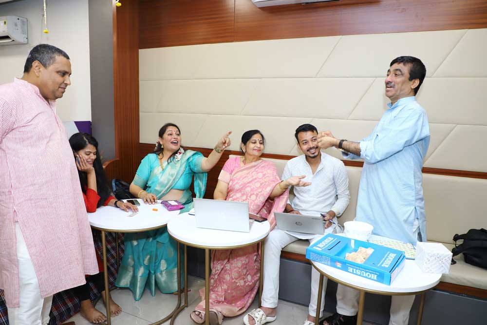 Some colleagues talking among themselves during a celebration in the office